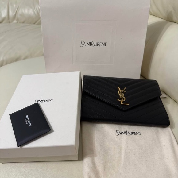 Saint Laurent Handbags - Saint Laurent Black Quilted Clutch with Gold Logo